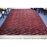 A Turkish red ground carpet 340 x 250cm