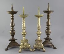 Two pairs of 17th century style bronze / brass candlesticks, height 16.5in. and 15in.