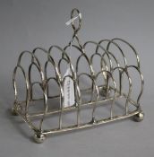 A George III seven bar toastrack by John & Thomas Settle, Sheffield, 1817, width 16cm.