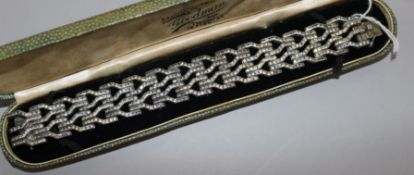 An Art Deco white metal and paste set bracelet, 18cm.