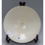 A Chinese cream glazed bowl on stand
