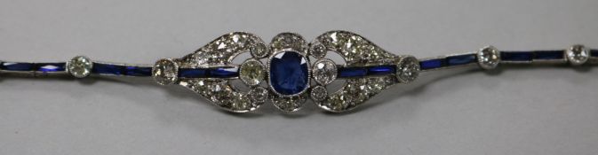 An attractive 1920's gold and platinum, sapphire and diamond bracelet, of pierced geometric