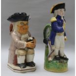 An early pearlware Toby jug and later jug of Nelson
