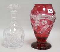 A ruby cut glass vase and a decanter