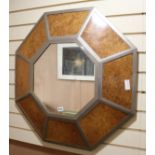 An octagonal burr walnut and metal mirror, W.81cm