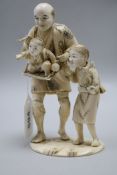 A Japanese sectional ivory okimono, farmer and children