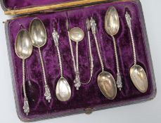 Seven assorted Victorian silver spoons and a pair of tongs, in case.
