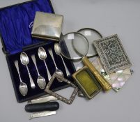 A small silver cigarette box, two card cases, two magnifying glasses and miscellaneous items