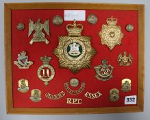 A board of Military cap badges and shoulder titles