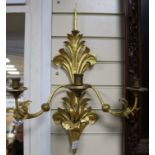 A pair of gilt metal three light wall sconces