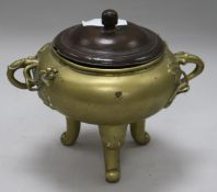 A Chinese bronze censer, wood cover