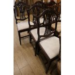 A set of six Hepplewhite style dining chairs