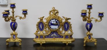 A French ormolu and Sevres style clock garniture