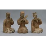Three Chinese pigment painted kneeling figures of musicians, Han Dynasty or later