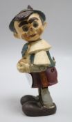 A novelty carved wooden Pinocchio wind up toy figure