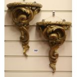 A pair of gilt wall brackets, W.23cm