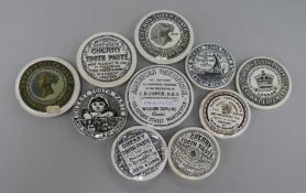 Nine Victorian cherry toothpaste pot lids, including May Roberts & Co. and Newbery & Sons together