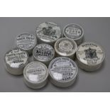 Nine Victorian circular pot lids with bases, including toothpaste and anchovy paste,