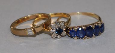 Three gold and gem set rings, two stamped 9ct.