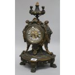 A bronze French mantel clock