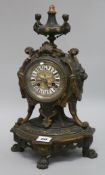 A bronze French mantel clock