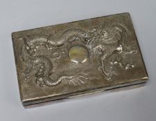 A Hong Kong silver 'dragon' cigarette box and two shoe ashtrays.