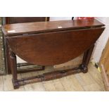 A Victorian oak oval topped folding table, W.91cm