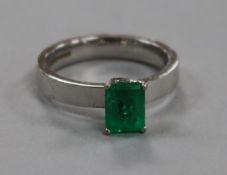 An 18ct white gold and solitaire emerald ring, size K.