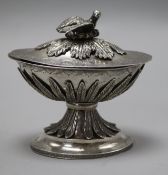 An Eastern white metal lidded twin compartment oval pedestal box, height 10.2mm.