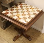 An onyx-topped games table, W.55cm