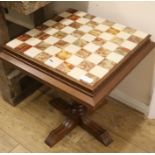 An onyx-topped games table, W.55cm