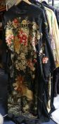 A black silk embroidered kimono, embroidered with flowers and a lion