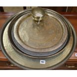 A pewter plate and three brass trays etc