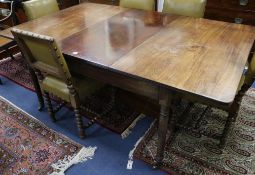 A George III mahogany extending dining table with two extra leaves W.183cm