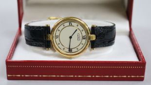 A lady's silver gilt Must de Cartier quartz wrist watch, with Cartier leather strap with