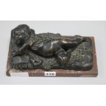 A bronze of a sleeping boy