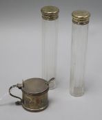 Two silver mounted glass toilet bottles and a silver mustard.