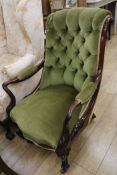 A Victorian rosewood green upholstered buttonback armchair