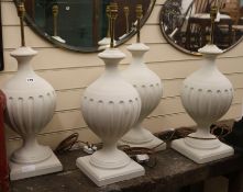 A set of four painted lamp bases