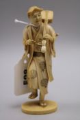 A Japanese ivory figure musician