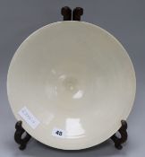 A Chinese cream glazed bowl on stand