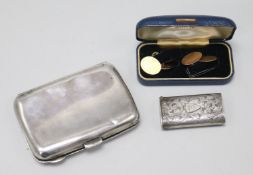 A Victorian silver vesta case, a silver cigarette case and a pair of 9ct gold cufflinks.