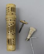 A carved ivory seal, a bone bodkin case and a miniature ivory handled cork screw