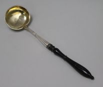 A mid 19th century Russian 84 zolotnik silver ladle, with turned wooden handle, assay master, Andrei