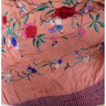 A coral silk Chinese coloured embroidered shawl