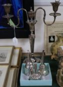 A plated two branch candelabra, three silver plated wine funnels including two 19th Century