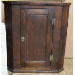 A George III oak corner cupboard, W.83cm