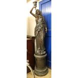 A large bronze statue of a lady, W. approx 40cm