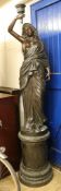 A large bronze statue of a lady, W. approx 40cm