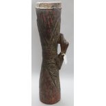 A tribal drum from Papua New Guinea, with carved duck handle and snake skin head